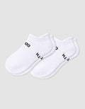 The Women's Essential Ankle Sock by Cozy Earth features a textured white design with subtle black text near the cuff, shown on a light gray background.|Color:White