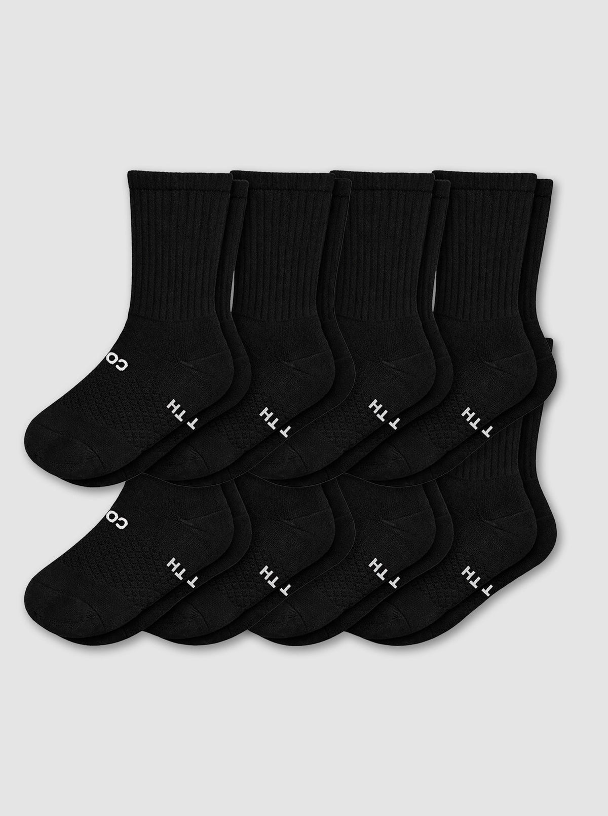 Eight pairs from the Cozy Earth Men's Essential Calf Sock 8-Pack in black are displayed in two neat overlapping rows on a light gray background, each featuring small white text and symbols near the toes.|Color:Black