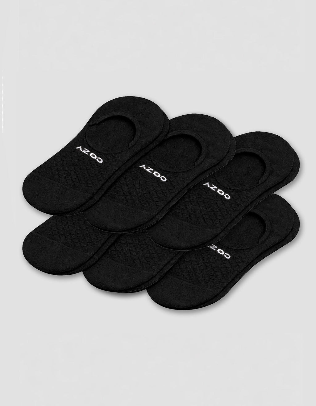Six pairs of black Cozy Earth Men's Essential No-Show Socks are stacked on a plain white background, each featuring "COZY" printed in white near the heel opening.|Color:Black