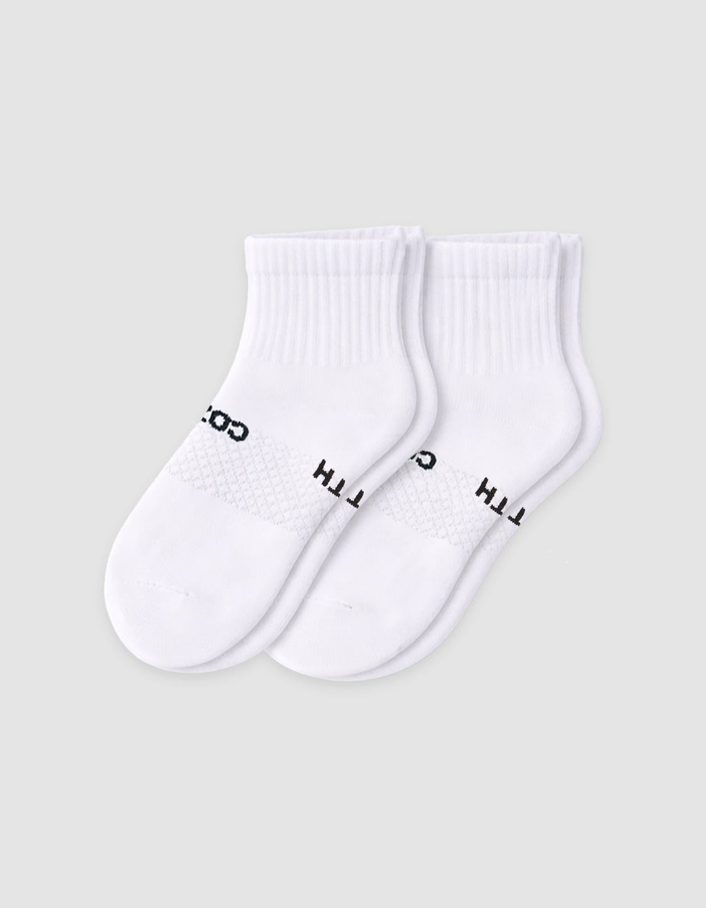The Cozy Earth Men's Essential Quarter Sock features white ribbed cuffs and a discreet black text design on the sides, displayed against a plain light background.|Color:White