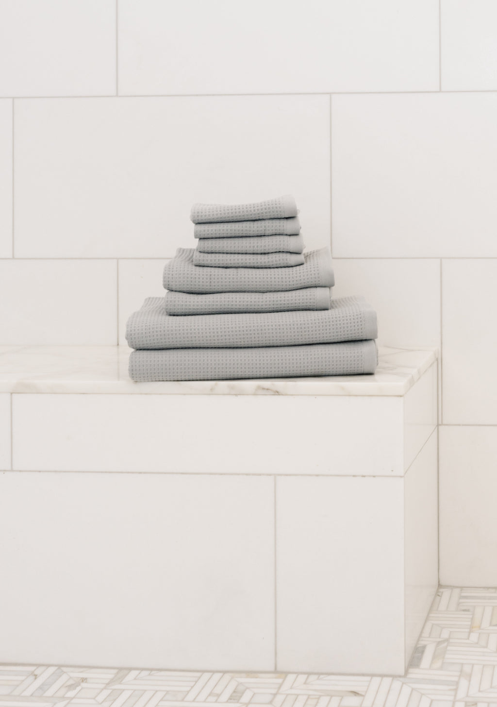 Waffle Bath Towel Set in the color Harbor Mist. Photo of Harbor Mist Waffle Bath Towel Set taken resting on a marble counter top. |Color:Harbor Mist