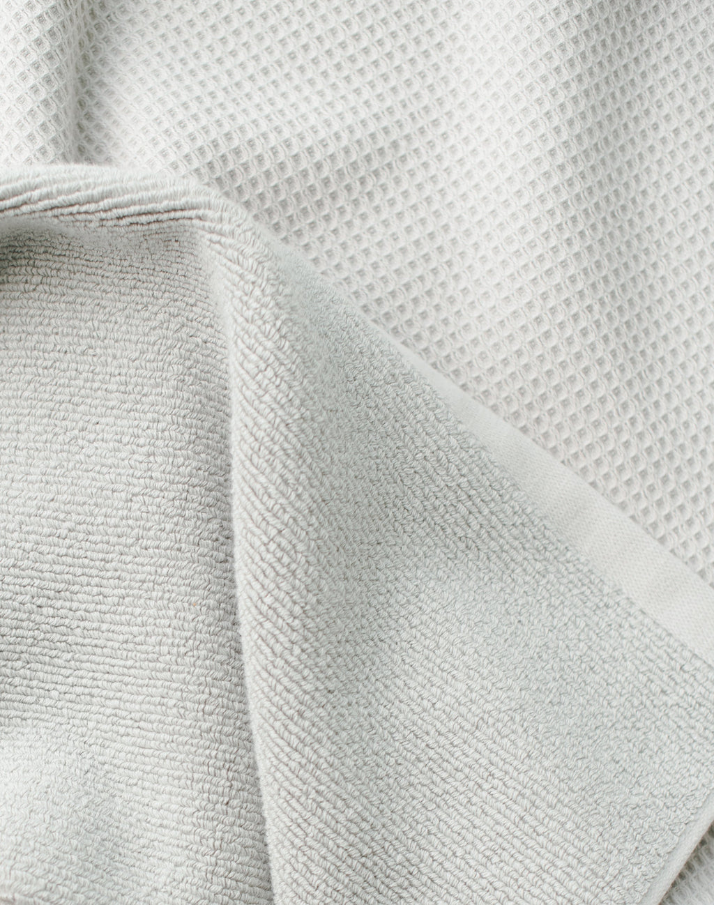 Waffle Bath Towel in the color Light Grey. Photo of Light Grey Waffle Bath Towel taken close up only showing the towel |Color: Light Grey