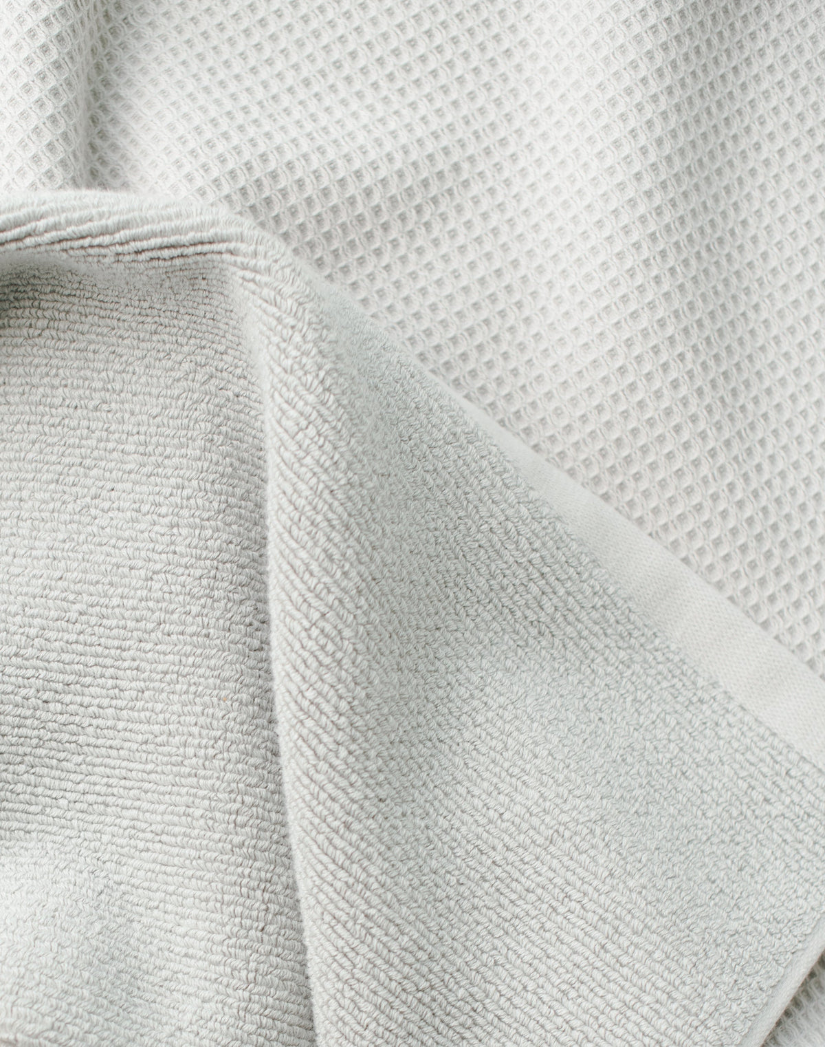 Waffle Bath Towel in the color Light Grey. Photo of Light Grey Waffle Bath Towel taken close up only showing the towel |Color: Light Grey
