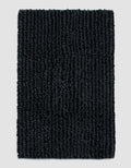 The Cozy Earth Plush Loop Bath Mat, rectangular and dark gray with thick textured fibers, is displayed on a plain light gray background.|Color:Graphite