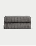 Charcoal Waffle Hand Towel set neatly folded. The photo was taken with a white background. |Color:Charcoal