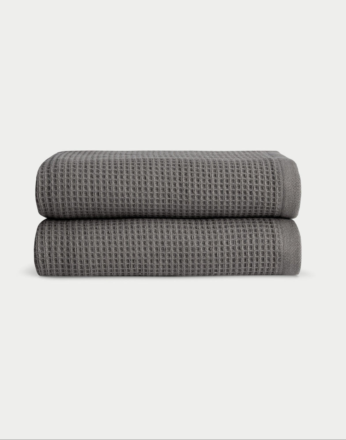 Charcoal Waffle Hand Towel set neatly folded. The photo was taken with a white background. |Color:Charcoal