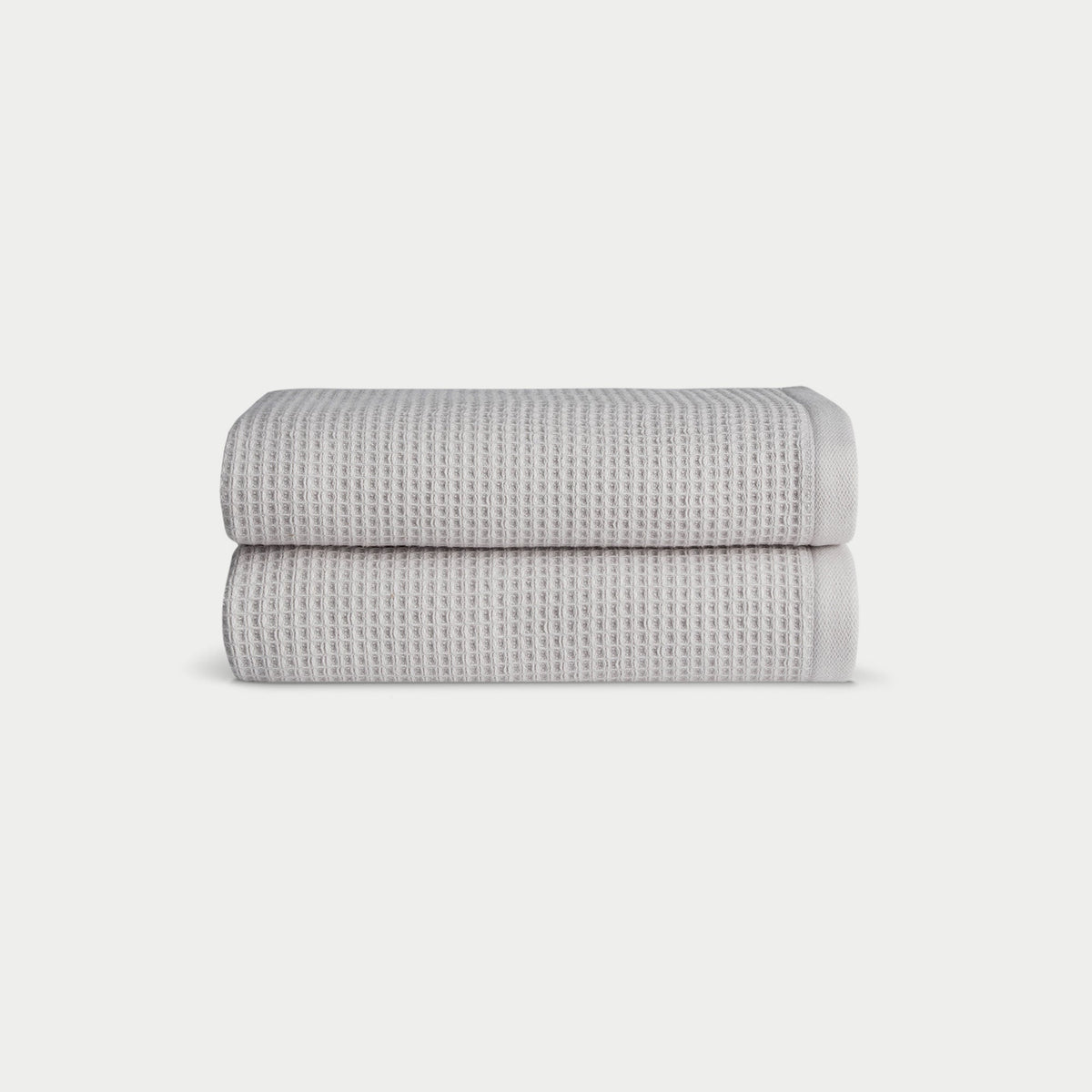 Light Grey Waffle Hand Towel set neatly folded. The photo was taken with a white background. |Color:Light Grey