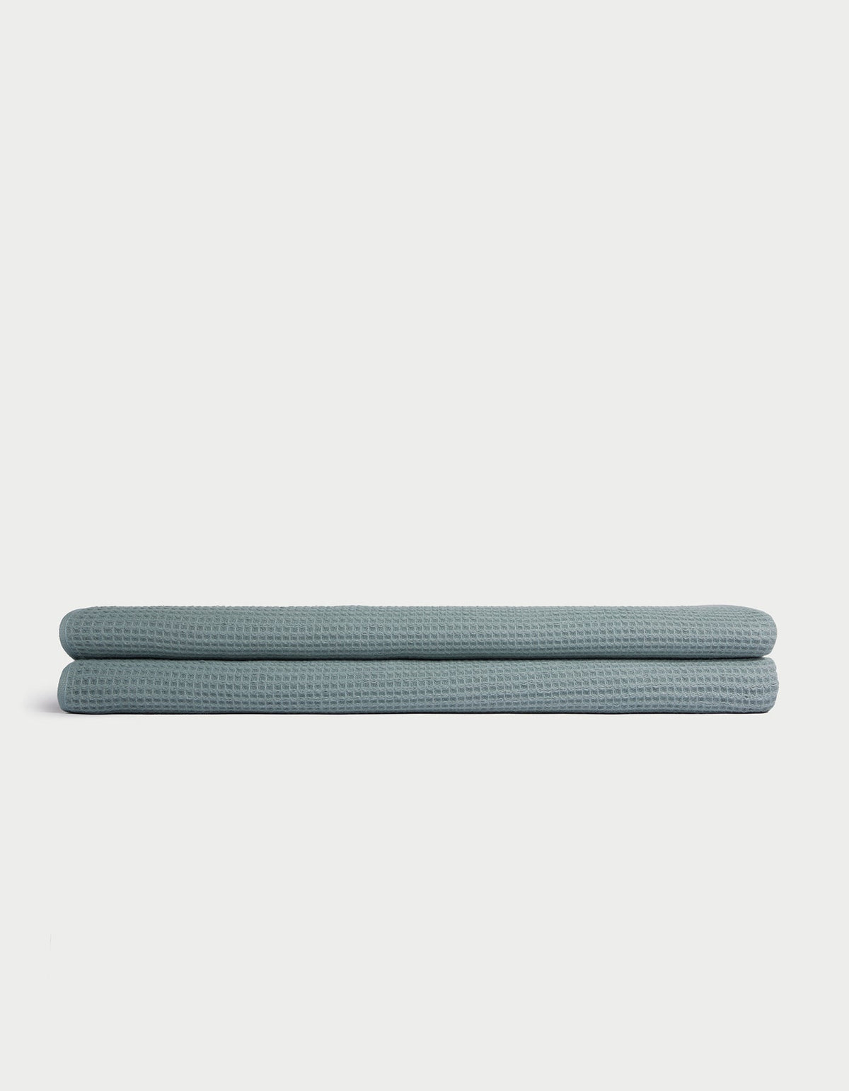 A folded light blue Cozy Earth Waffle Bath Sheet is displayed on a plain white background. |Color:Brook