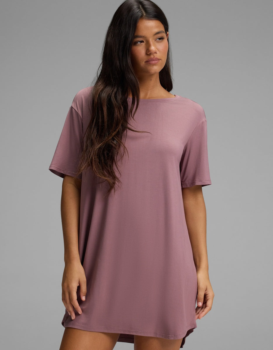 A woman wearing a mauve short-sleeved Cozy Earth Women’s Bamboo Stretch-Knit Sleep Dress.|Color:Copper Rose