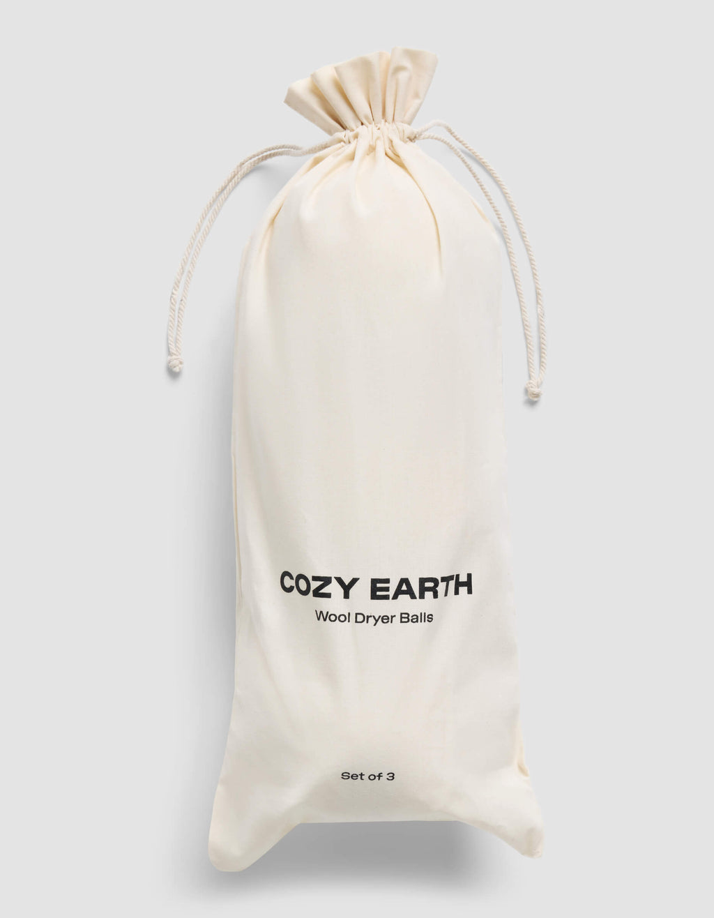 A cream-colored drawstring bag with "Cozy Earth Wool Dryer Balls" and "Set of 3" printed on it is displayed against a plain light gray background.|Size:Large