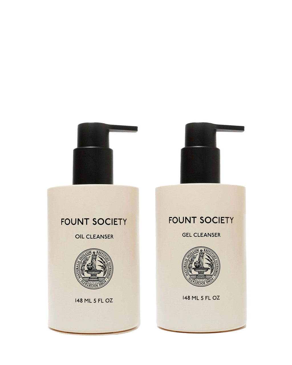 Two beige pump bottles from Cozy Earth’s Double Cleanse Duo—Oil Cleanser on the left, Gel Cleanser on the right—feature black pumps, black text, round front emblems, and each holds 148 mL (5 fl oz).
